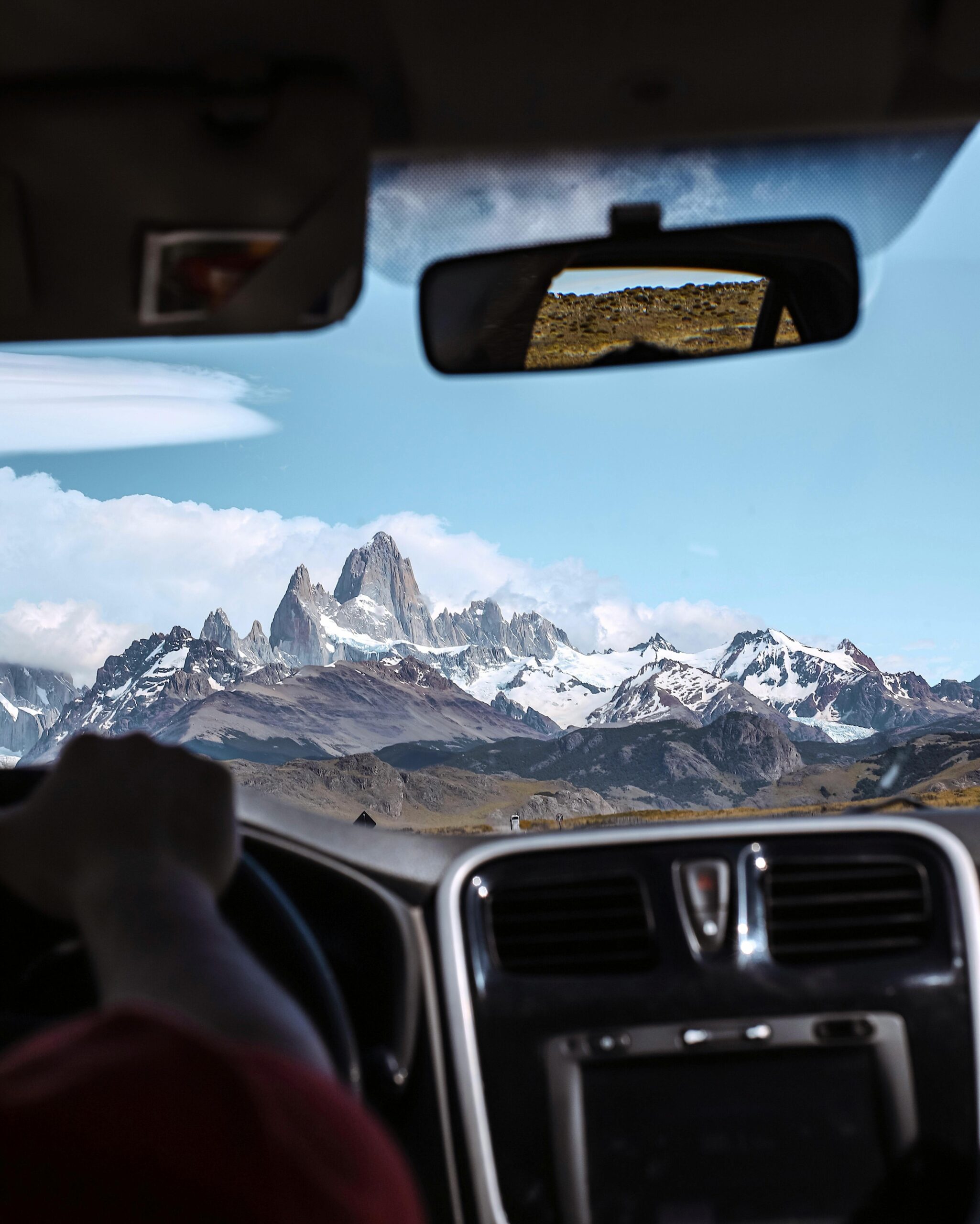 View of Mount Fitz Roy from a car on a scenic drive in El Chalten, Patagonia, Argentina.